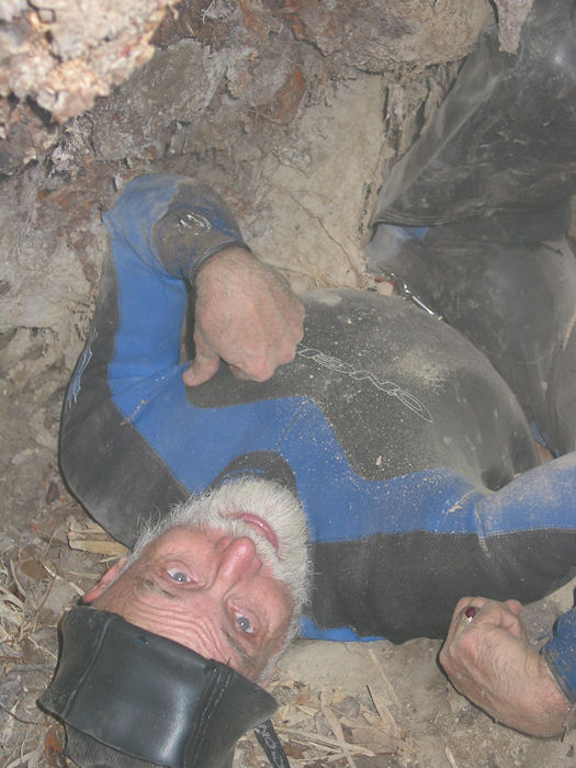 Dusty Rubberman Harold gazes at dirt roof